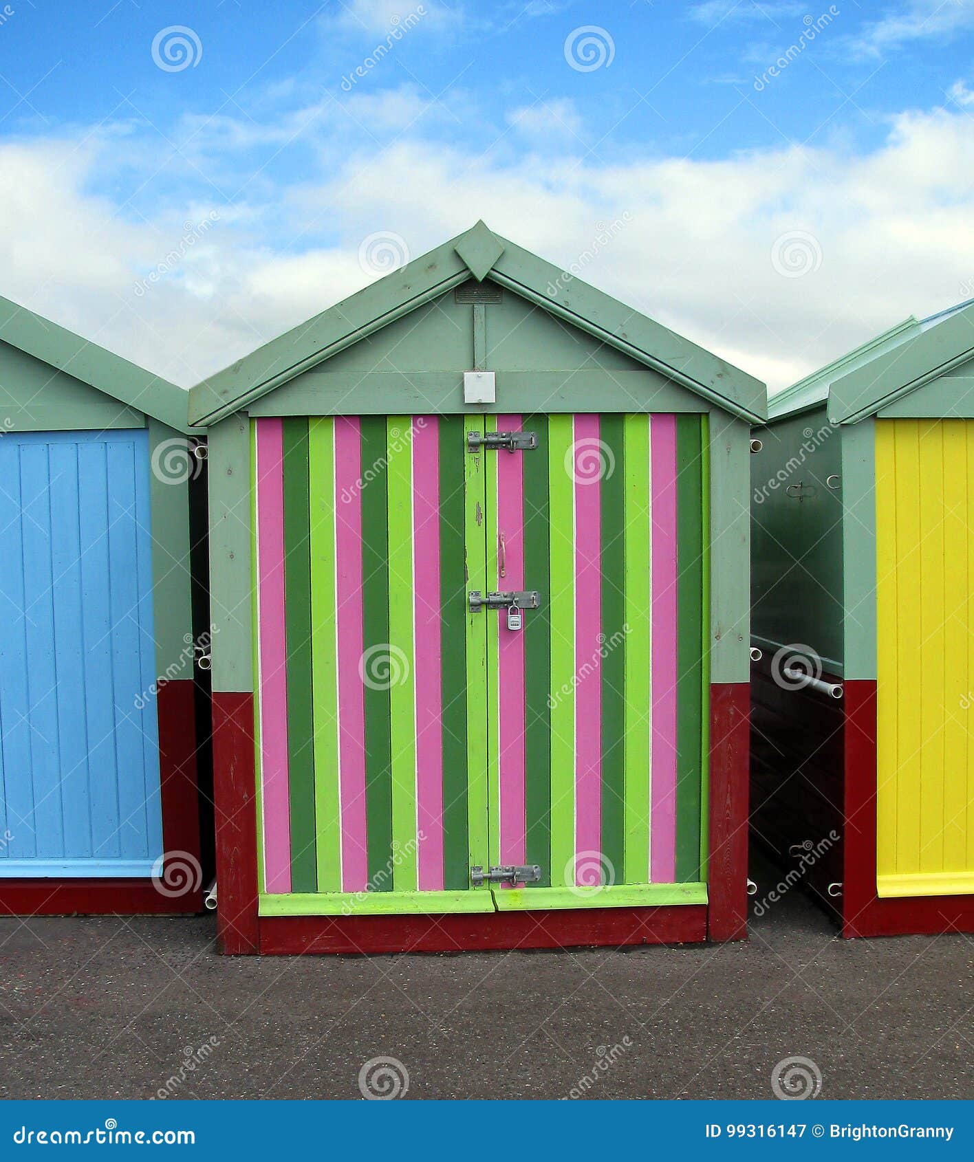 Brighton Beach huts/boxes on a blue sky sunny day with bright