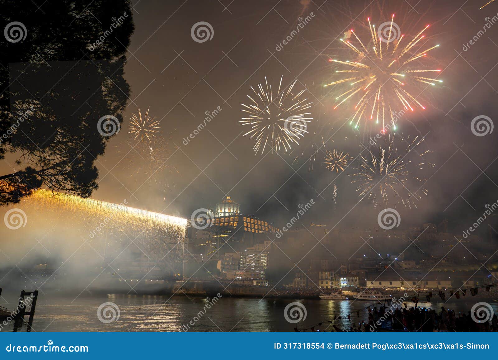 colorful beautiful fireworks over douro river in porto portugal on sao joao festival