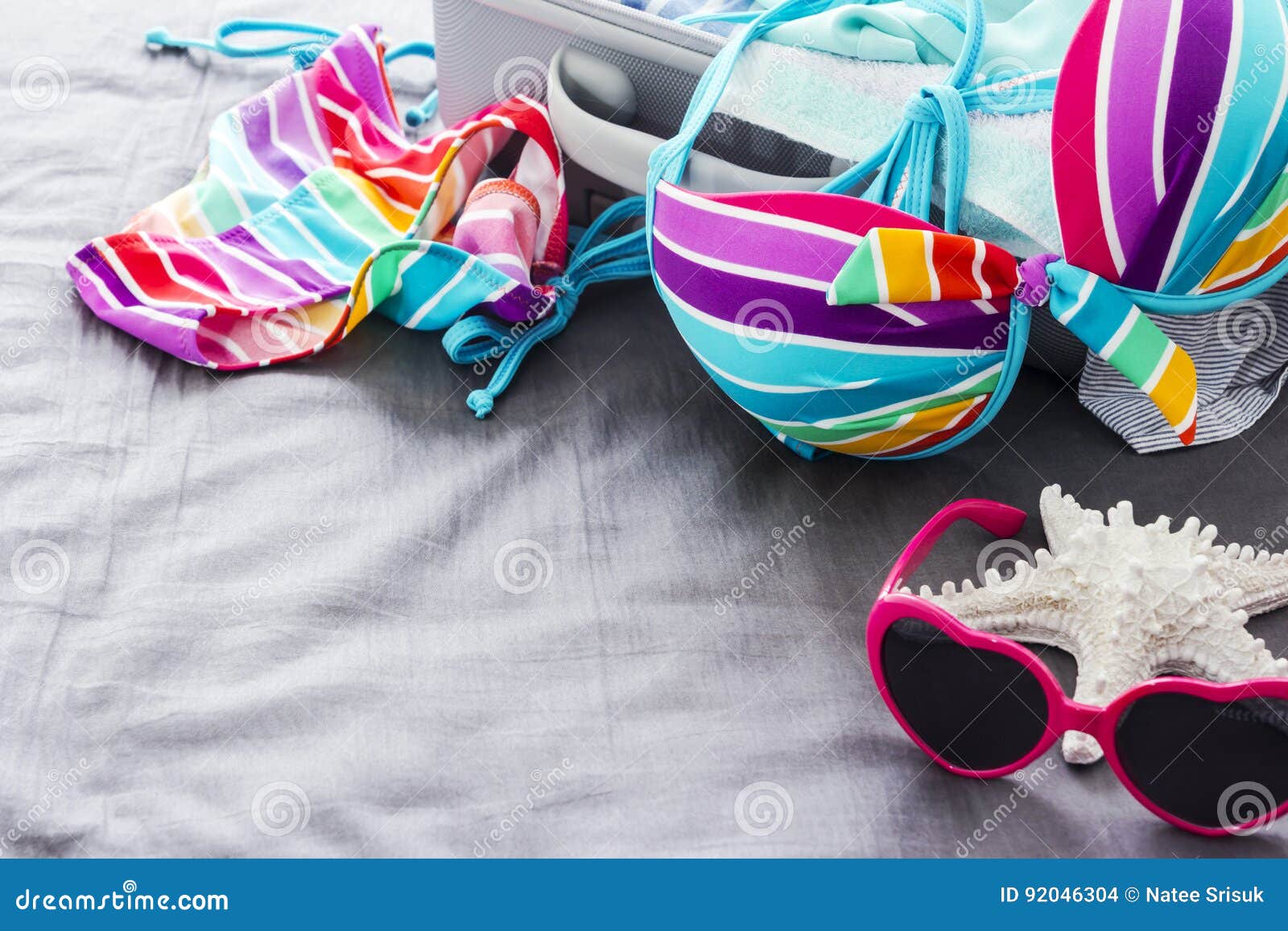 Colorful bikini on the bed stock photo. Image of beach - 92046304