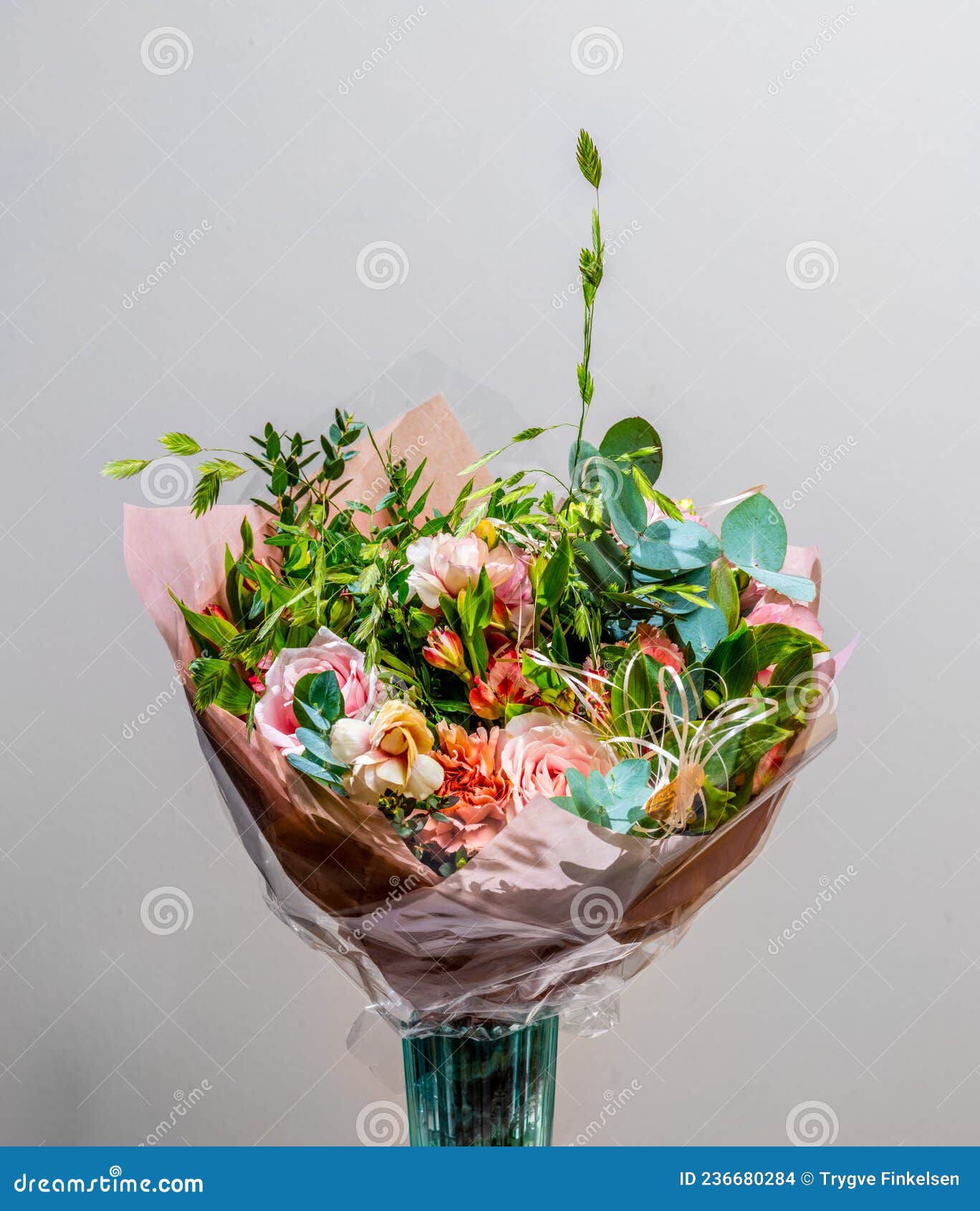 a colorful bouquet with roses and other flowers..