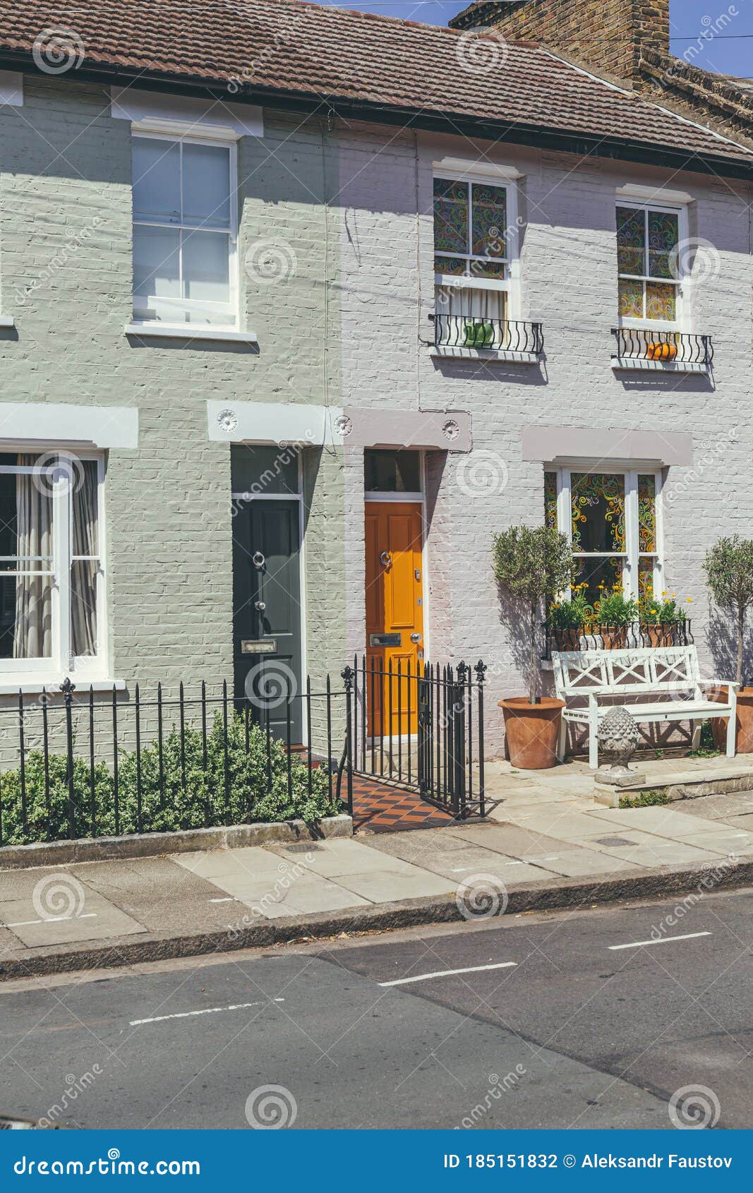 colorful bright doors on a facade of a typical british terrace houses