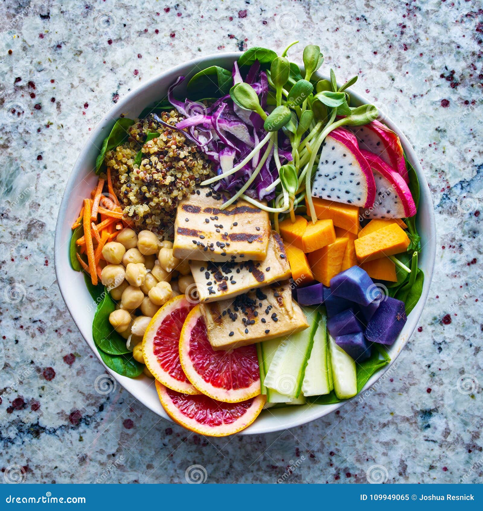 colorful buddha bowl with grilled tofu and dragon fruit