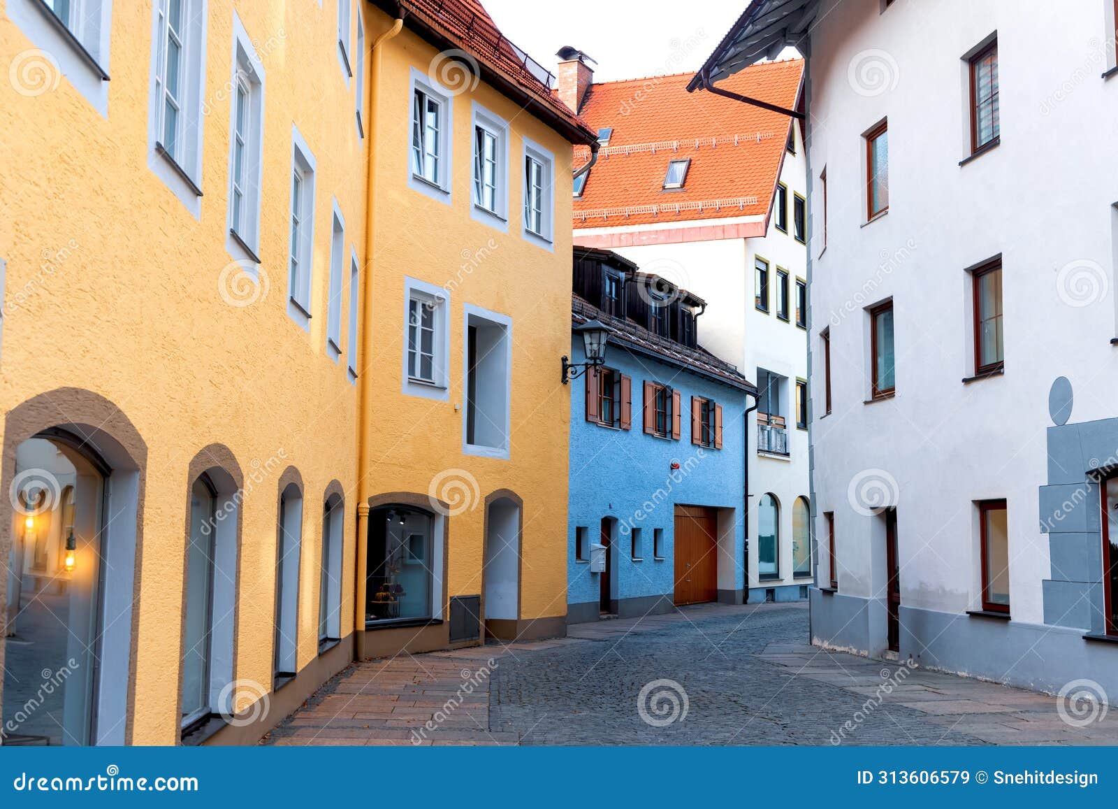 colorful buildings along a street in historic fussen, is a small town in, germany