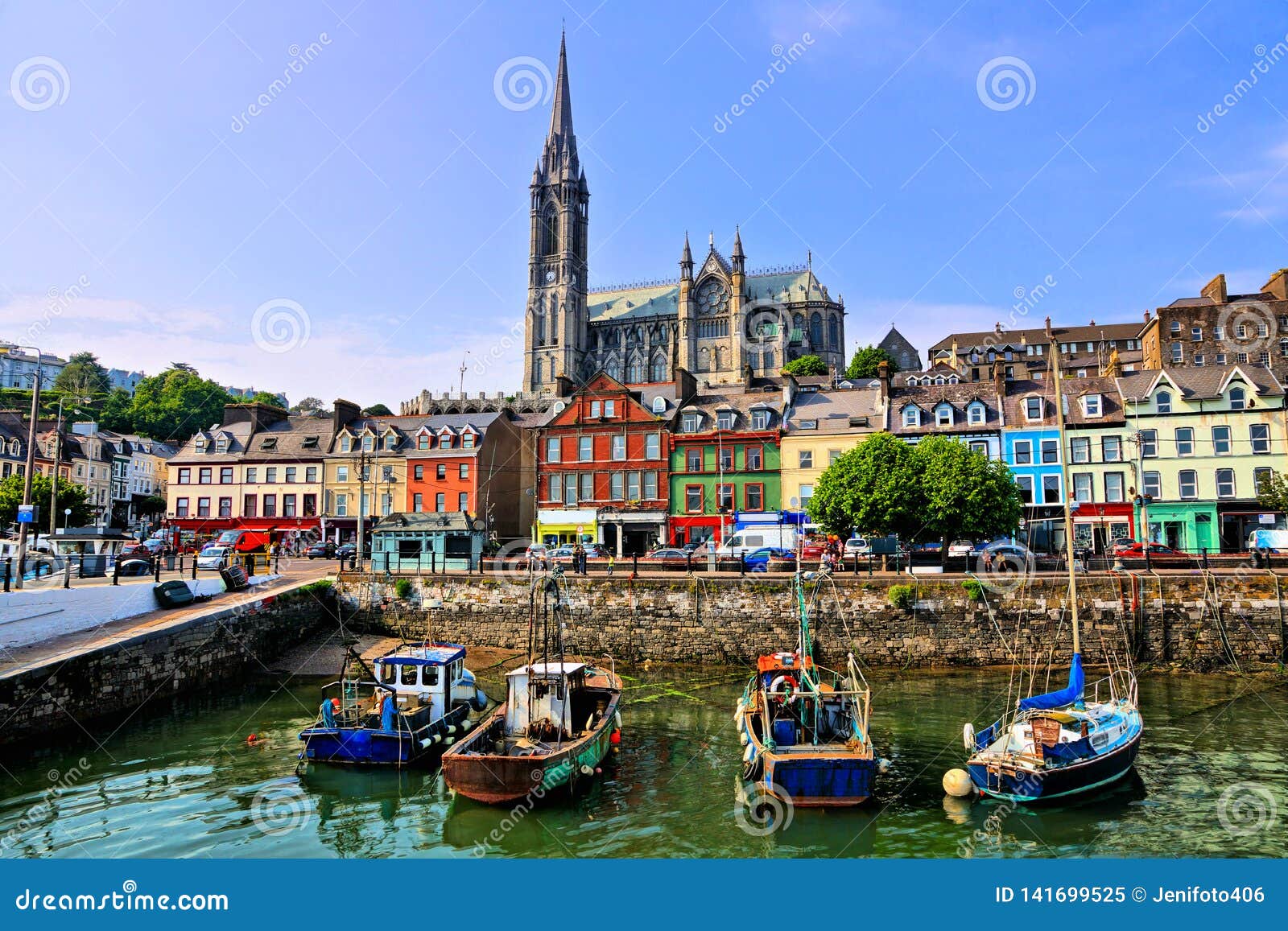 colorful buildings, old boats and cathedral, cobh harbor, county cork, ireland