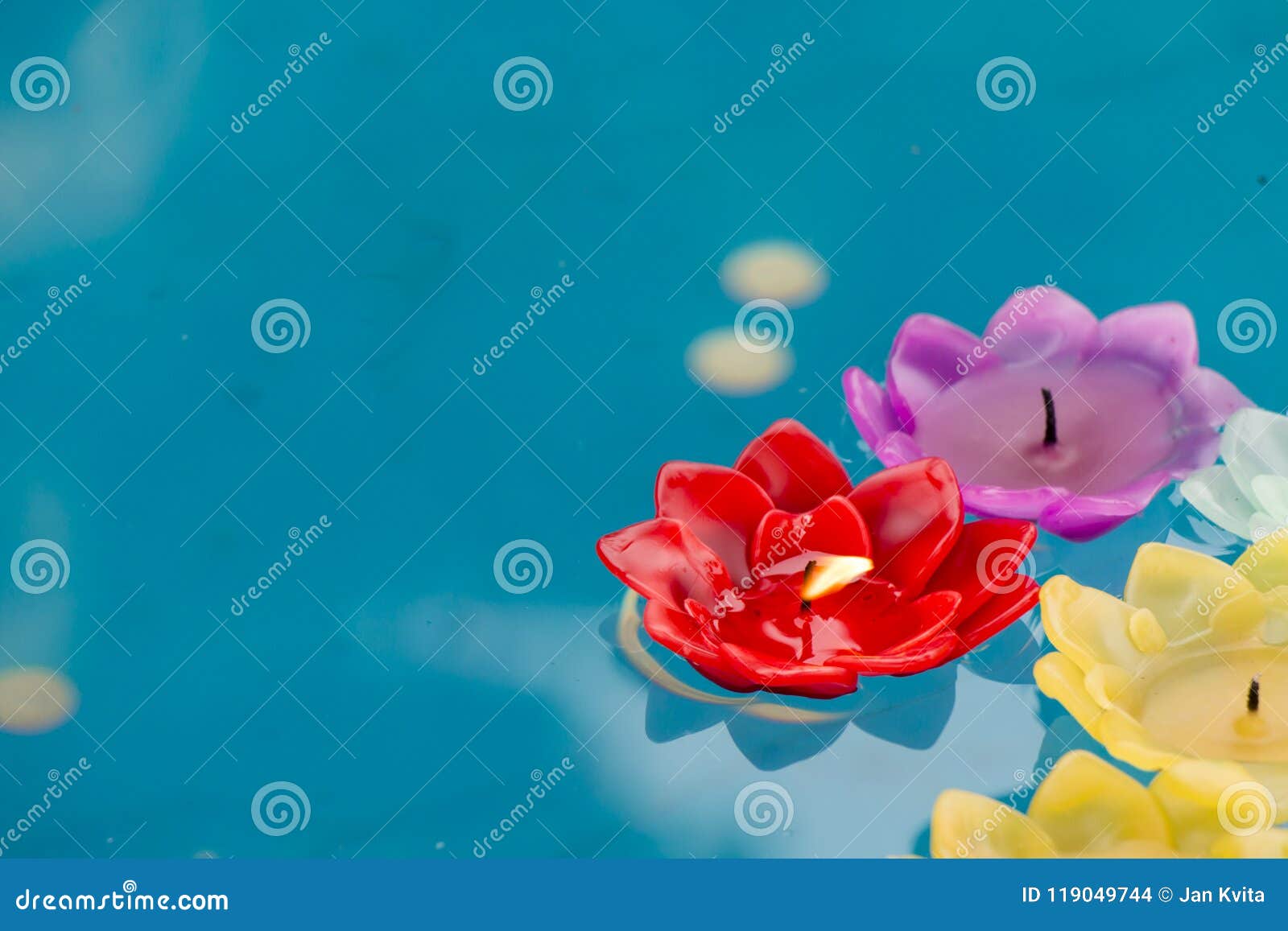 Colorful Burning Candles Floating on Water. Stock Photo Image of