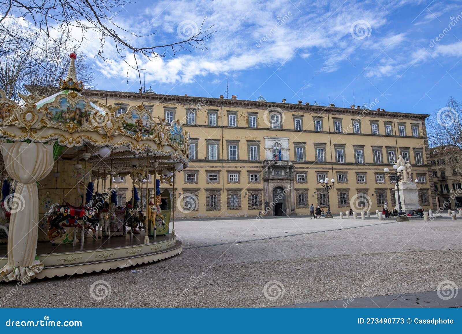 colorful carousel in front of the palazzo ducale on piazza napoleone in historic center of lucca, italy