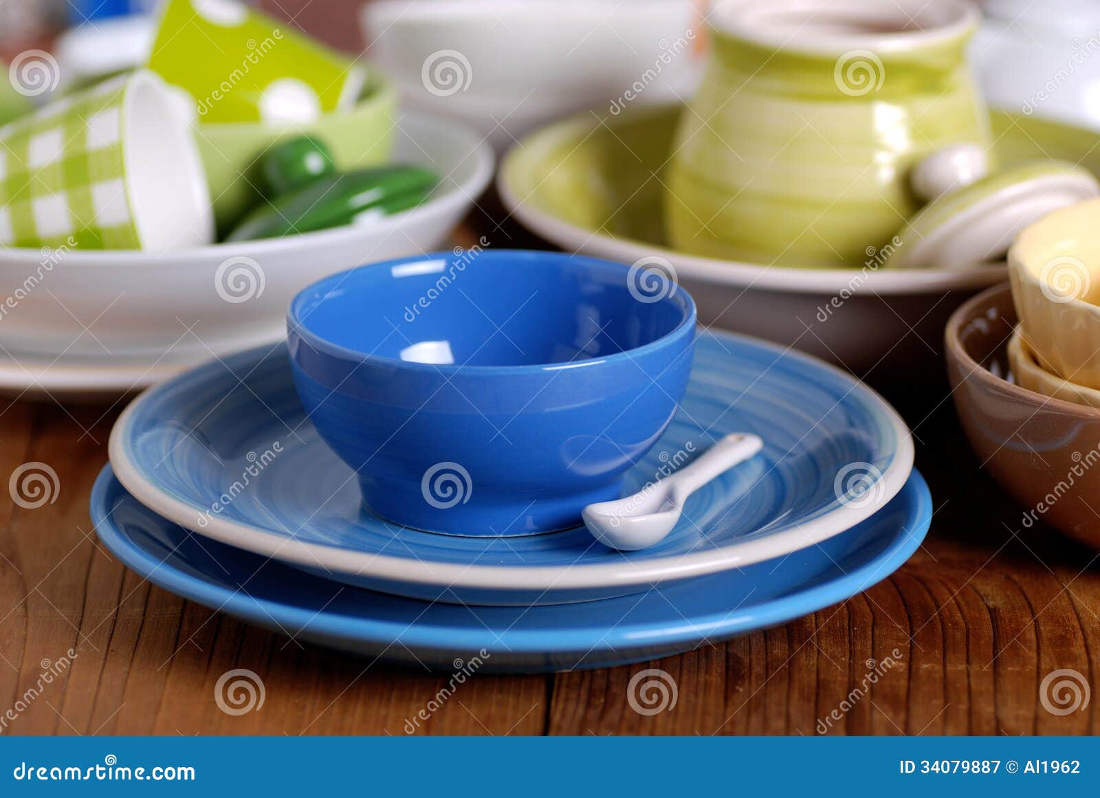 Set of spices, tableware and kitchen utensils in kitchen on table on mosaic  tiles background Stock Photo by ©belchonock 37623949