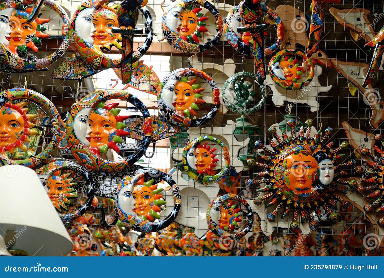 ceramic moon and sun faces on display in la tienda at puerto penasco mexico