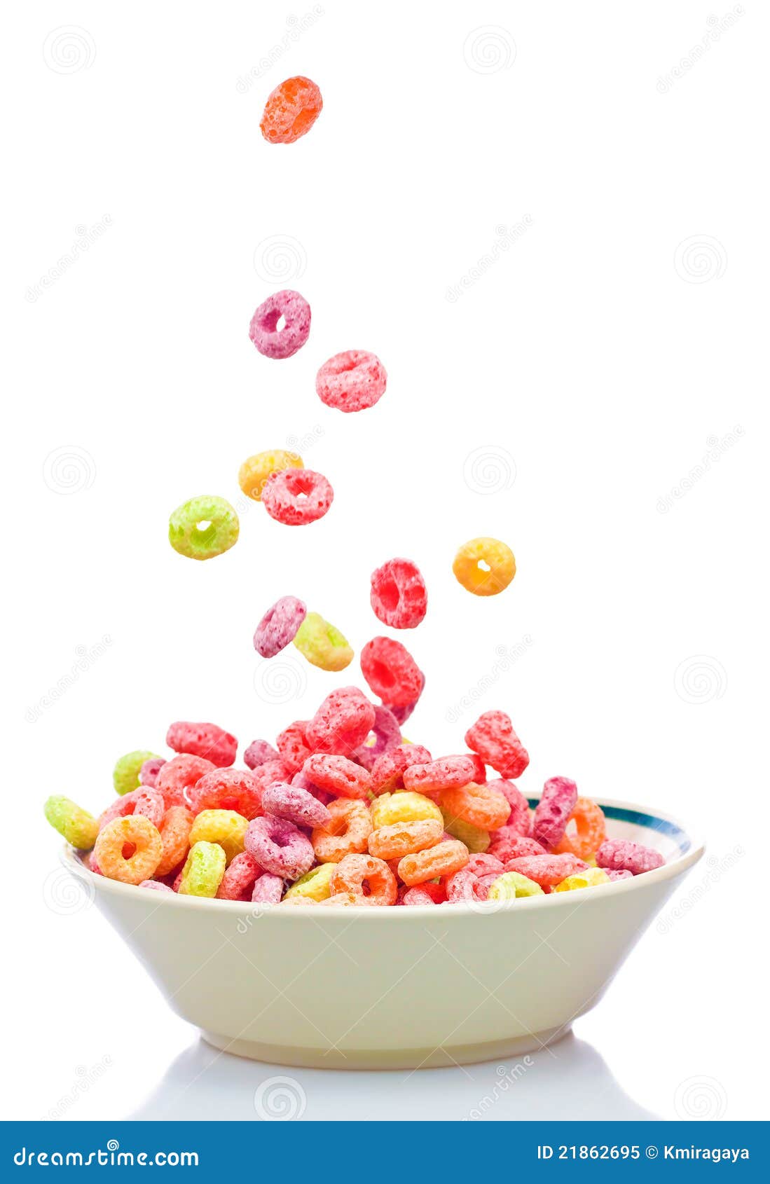 colorful cereal falling on a white bowl