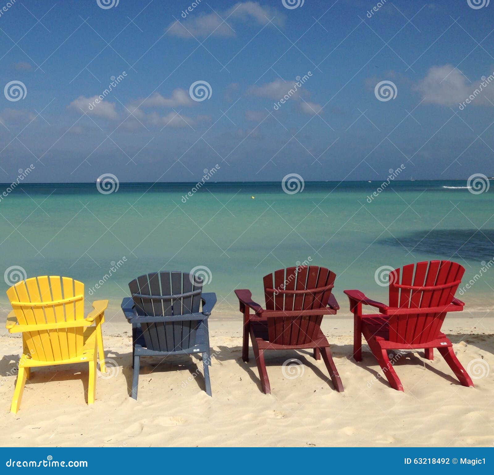 Colorful Chairs by the sea stock photo. Image of chairs 63218492