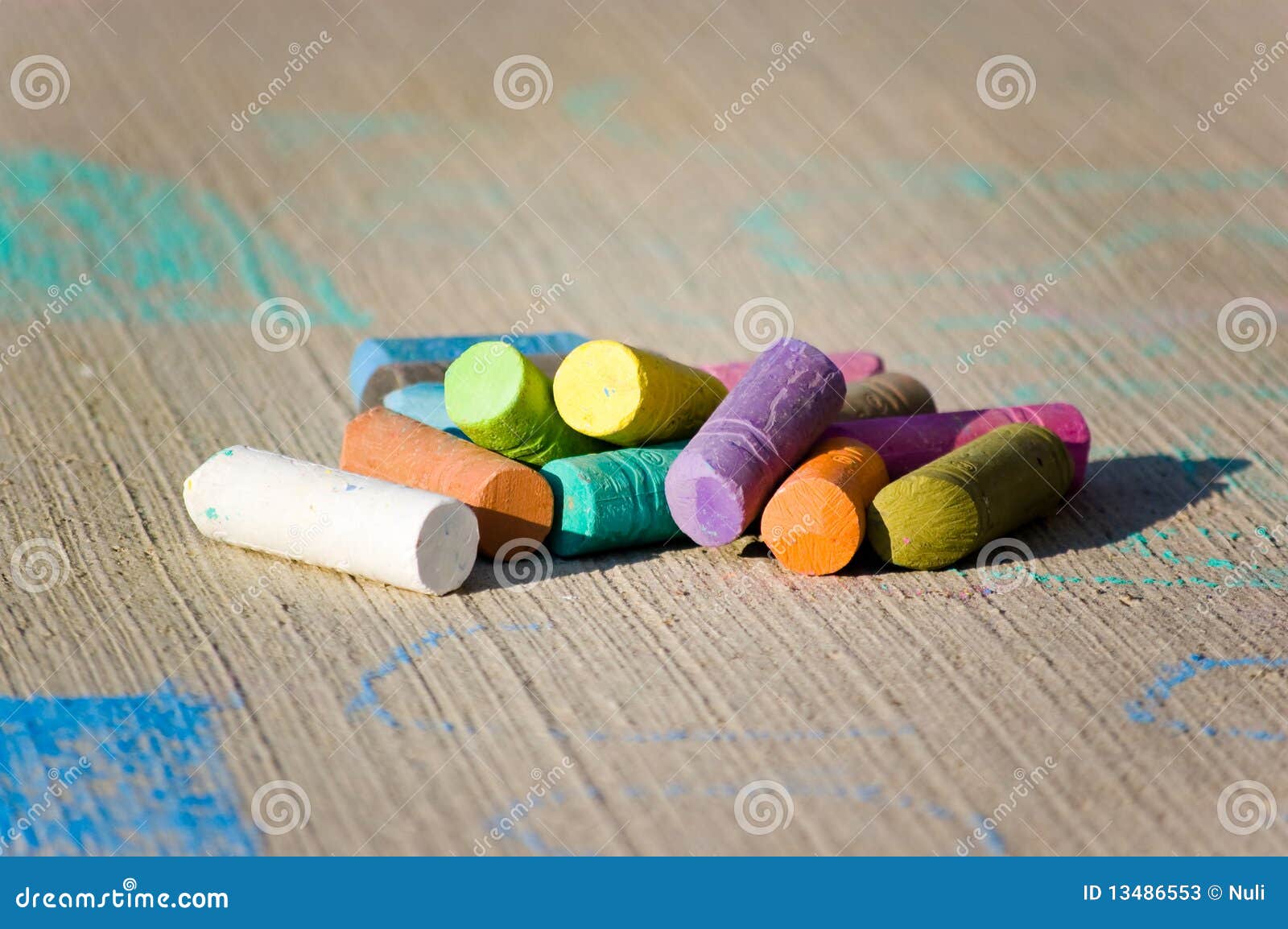 Colorful chalk on concrete stock image. Image of instrument 13486553