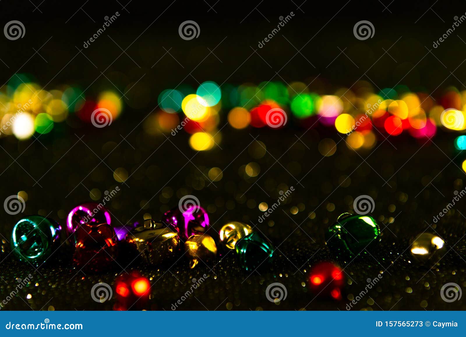 Colorful Christmas Jingle Bells. Yellow Filter. Blurred Bokeh