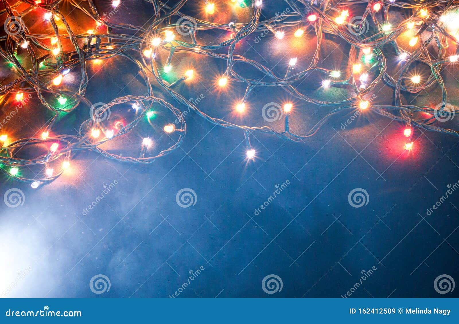 Colorful Christmas Lights on Blue Background Stock Image - Image of