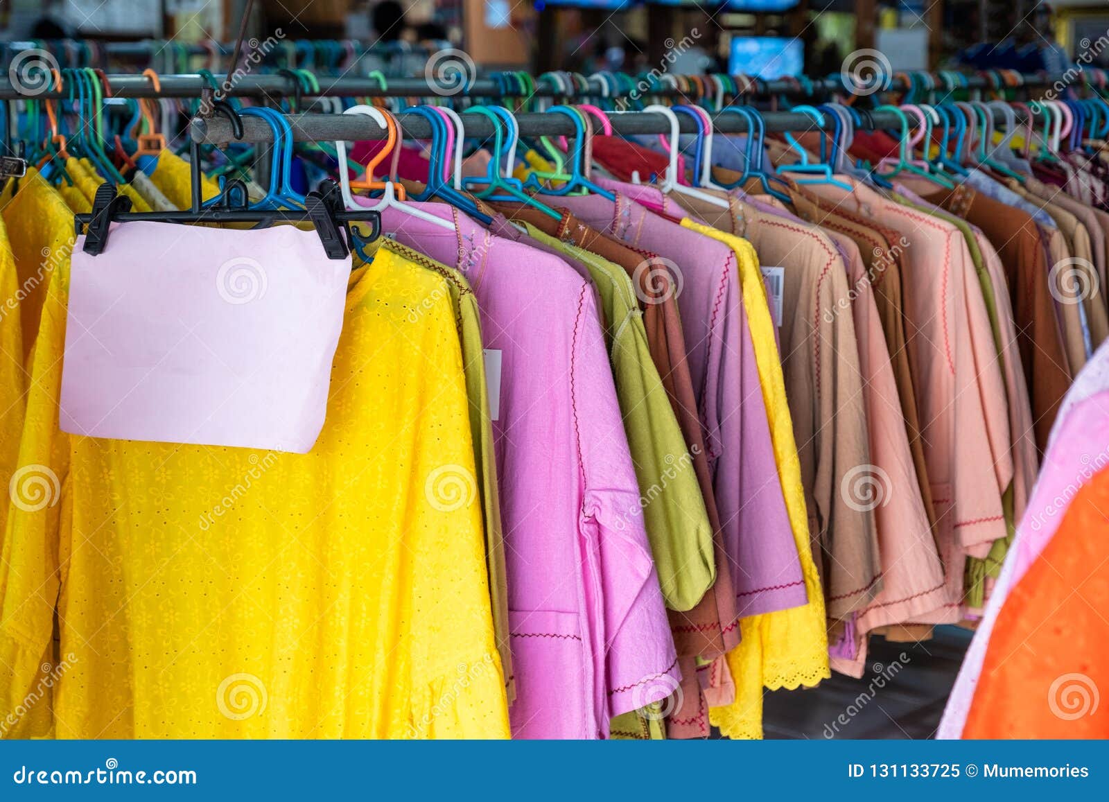 Colorful Clothes of Cotton Fabric Hanging on Rail in Store Stock Image ...