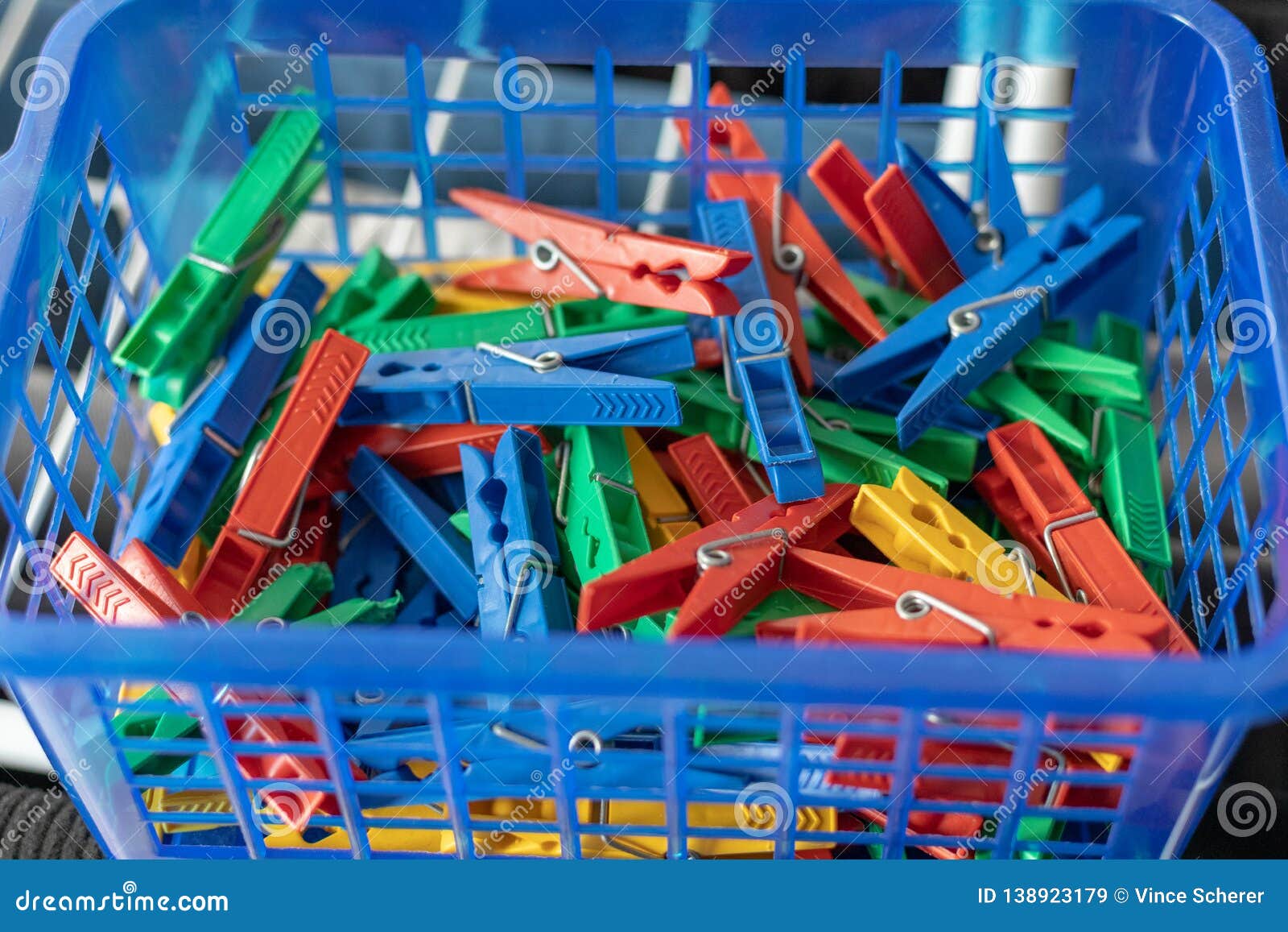 Colorful Clothespins in a Blue Basket Stock Image Image of hold