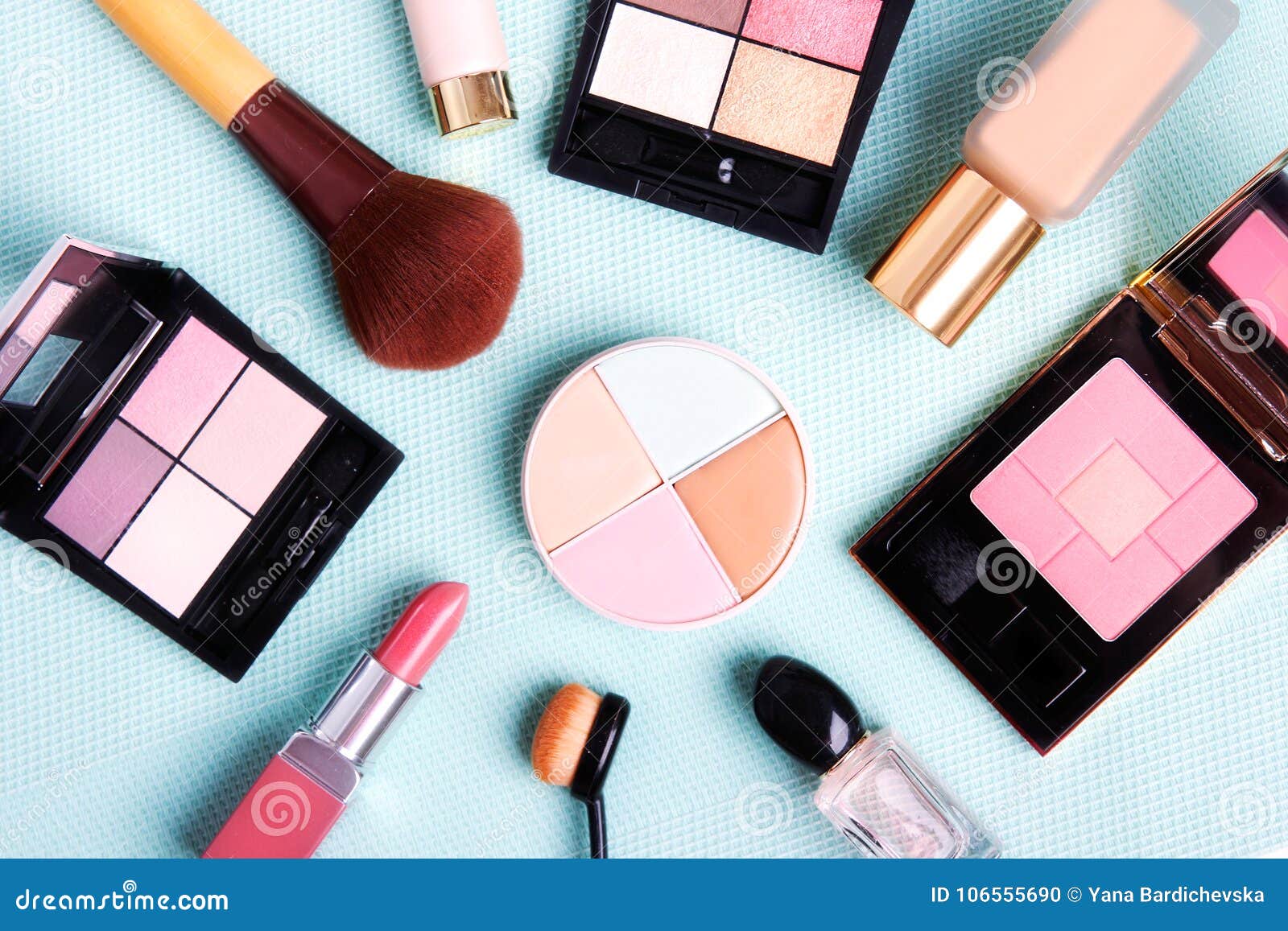 colorful cosmetics set on blue background.