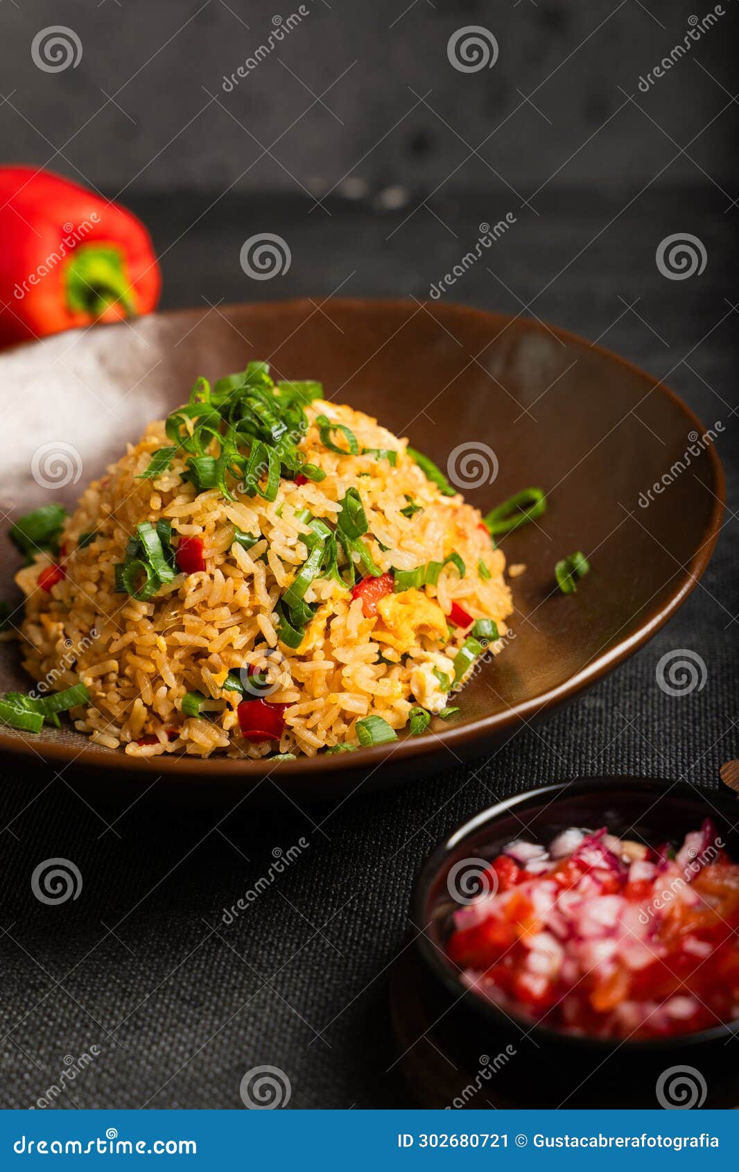 colorful dish of peruvian gastronomy called arroz chaufa.