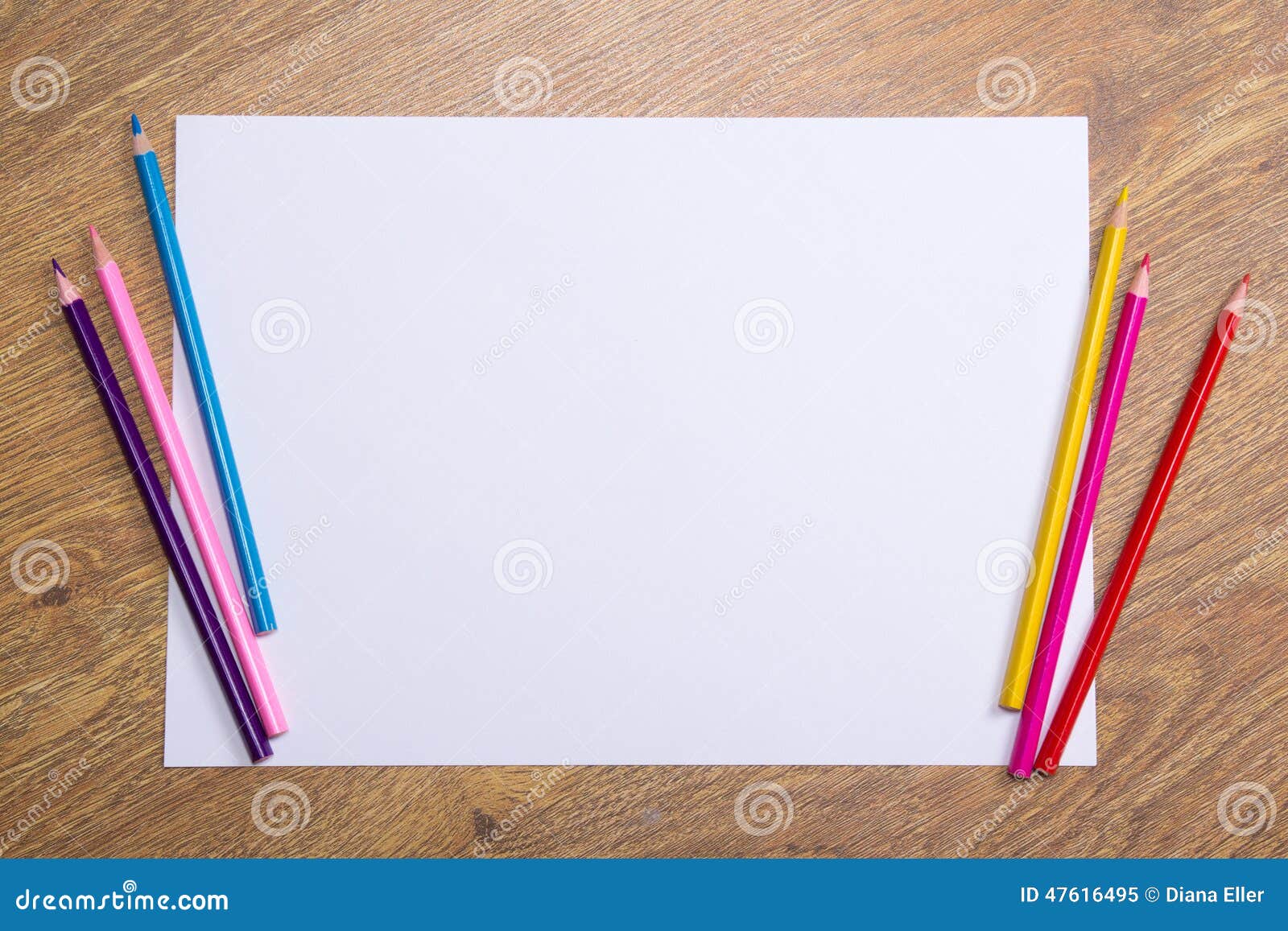 Colorful Drawing Pencils And Blank Paper On Wooden Table ...