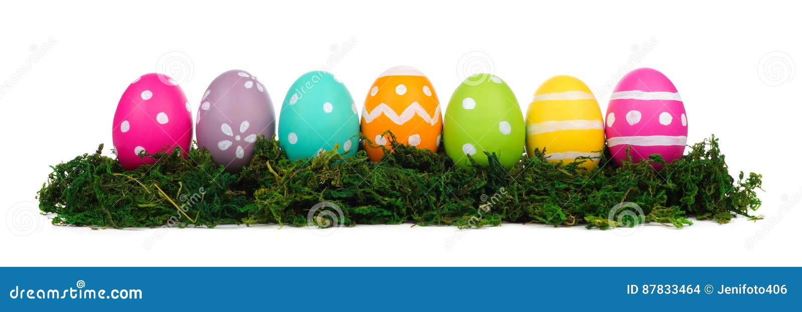Colorful Easter Eggs in Green Moss Isolated on White Stock Photo