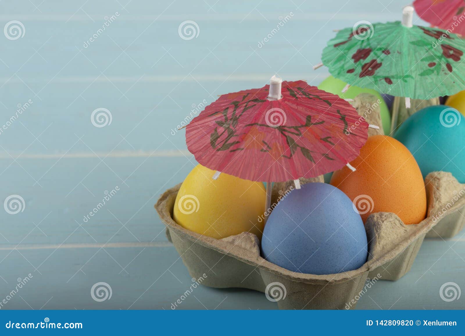 Colorful Easter Eggs Under Umbrellas in a Carton Stock Photo Image of