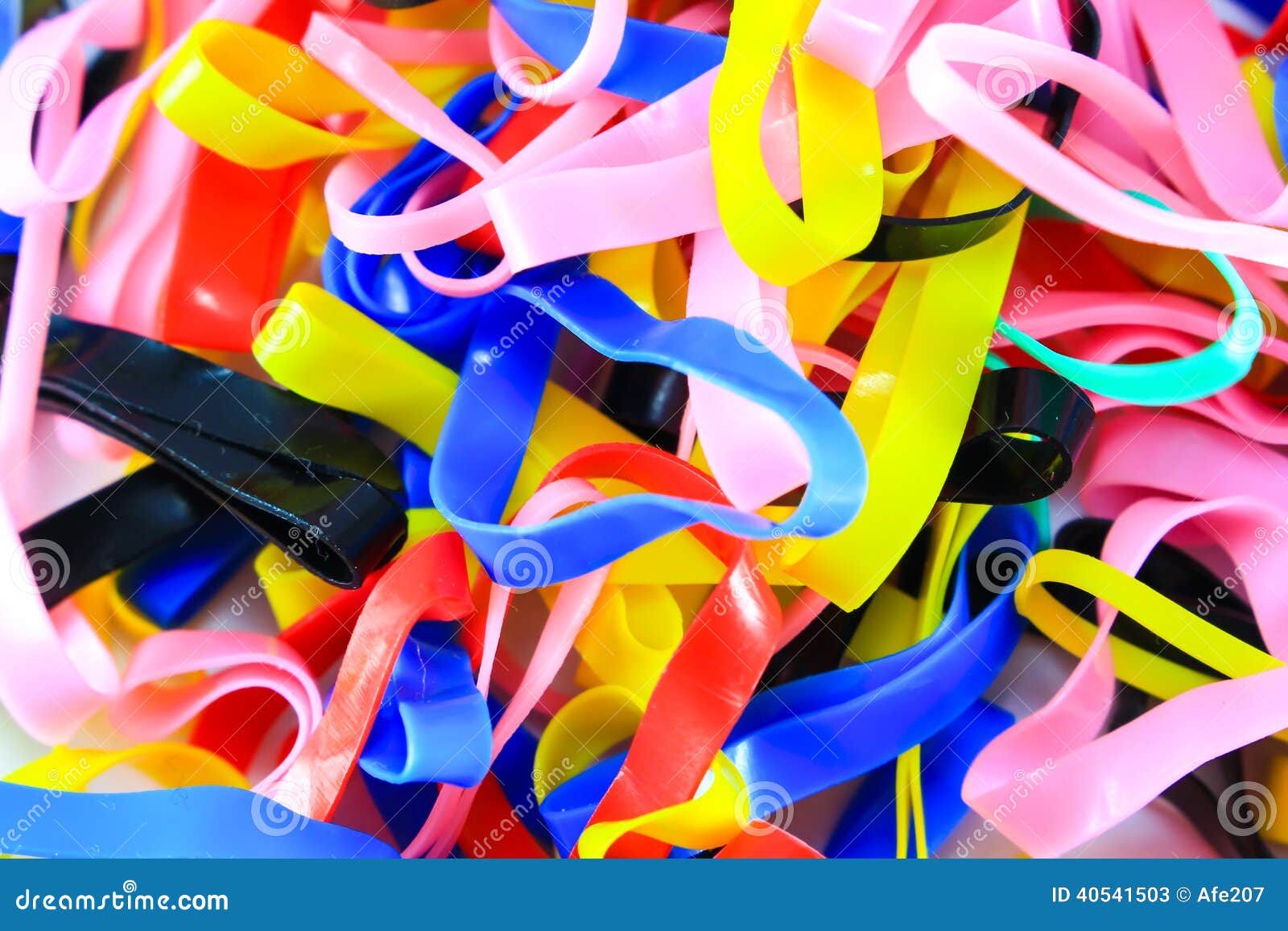 Colorful Elastic Rubber Bands on White Texture Background Stock Image
