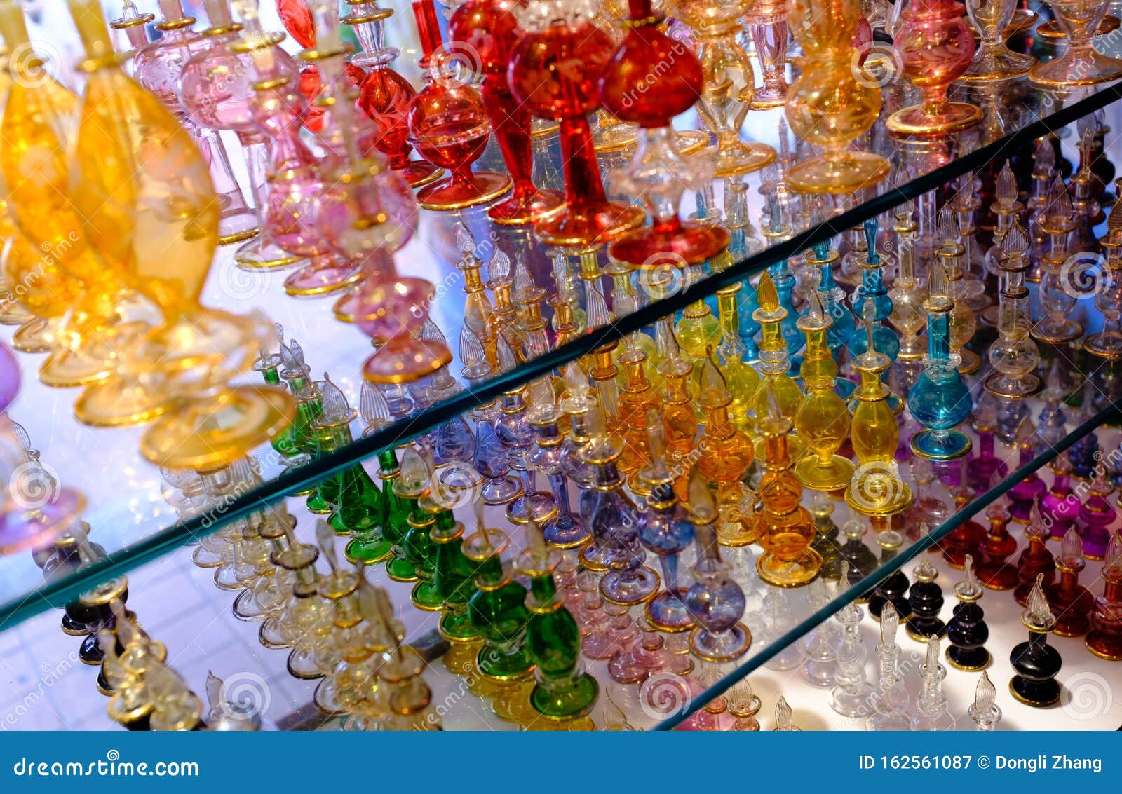 Colorful Essential Oil Perfume Bottles on a Showcase Stock Image