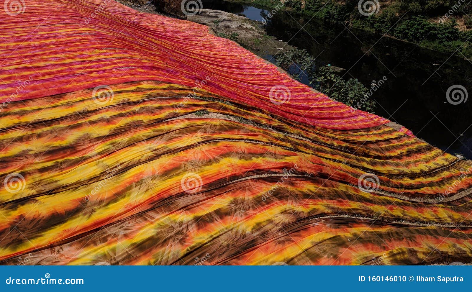 Colorful Fabric Drying after Traditional Dye Process Stock Photo