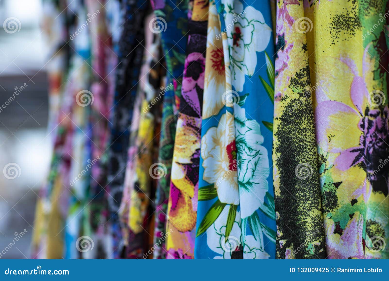 Colorful Fabrics Hanging and Lined. Fabrics with Different Patterns and
