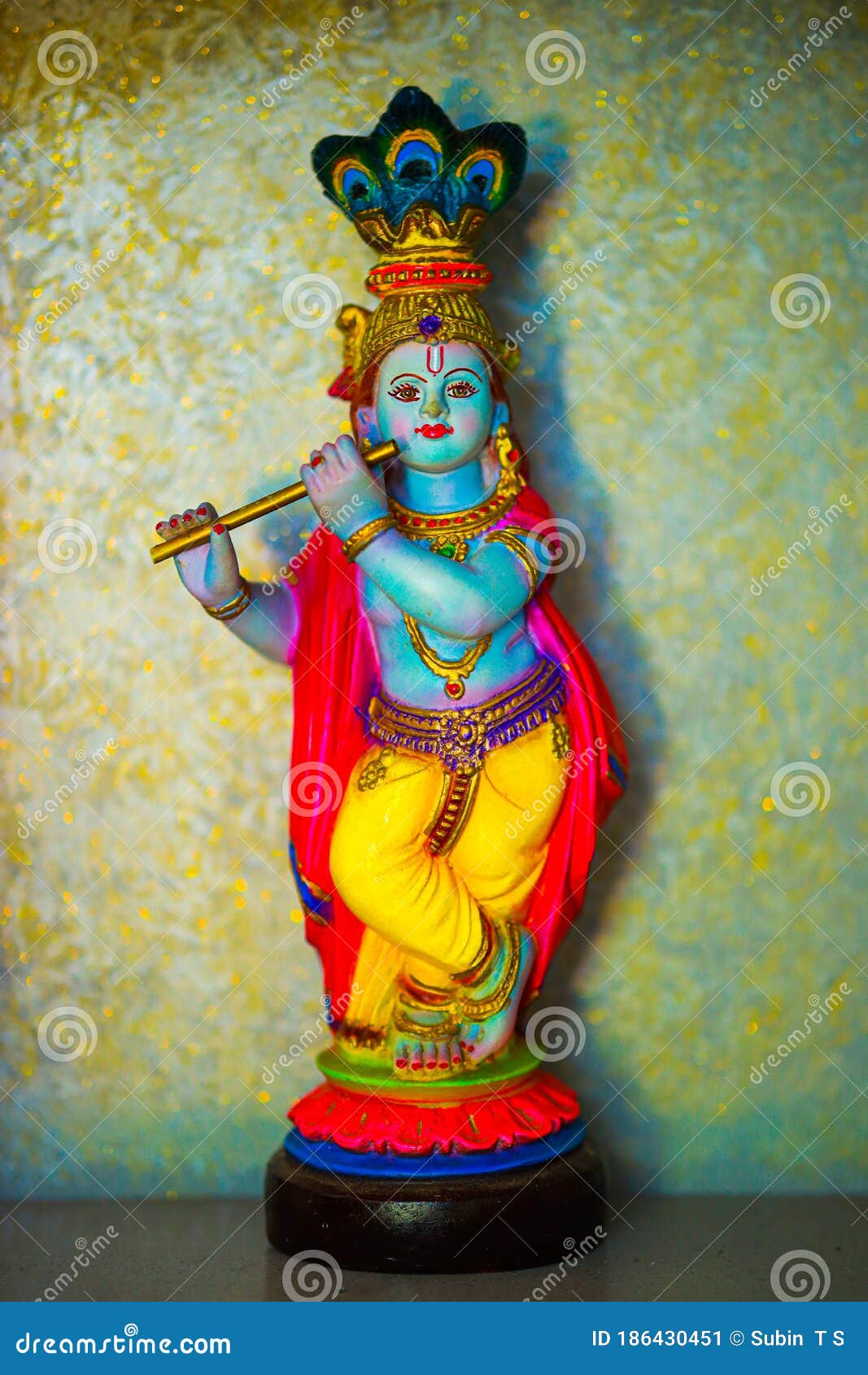 Colorful Figure of the Hindu God Krishna Playing the Flute. Lord ...