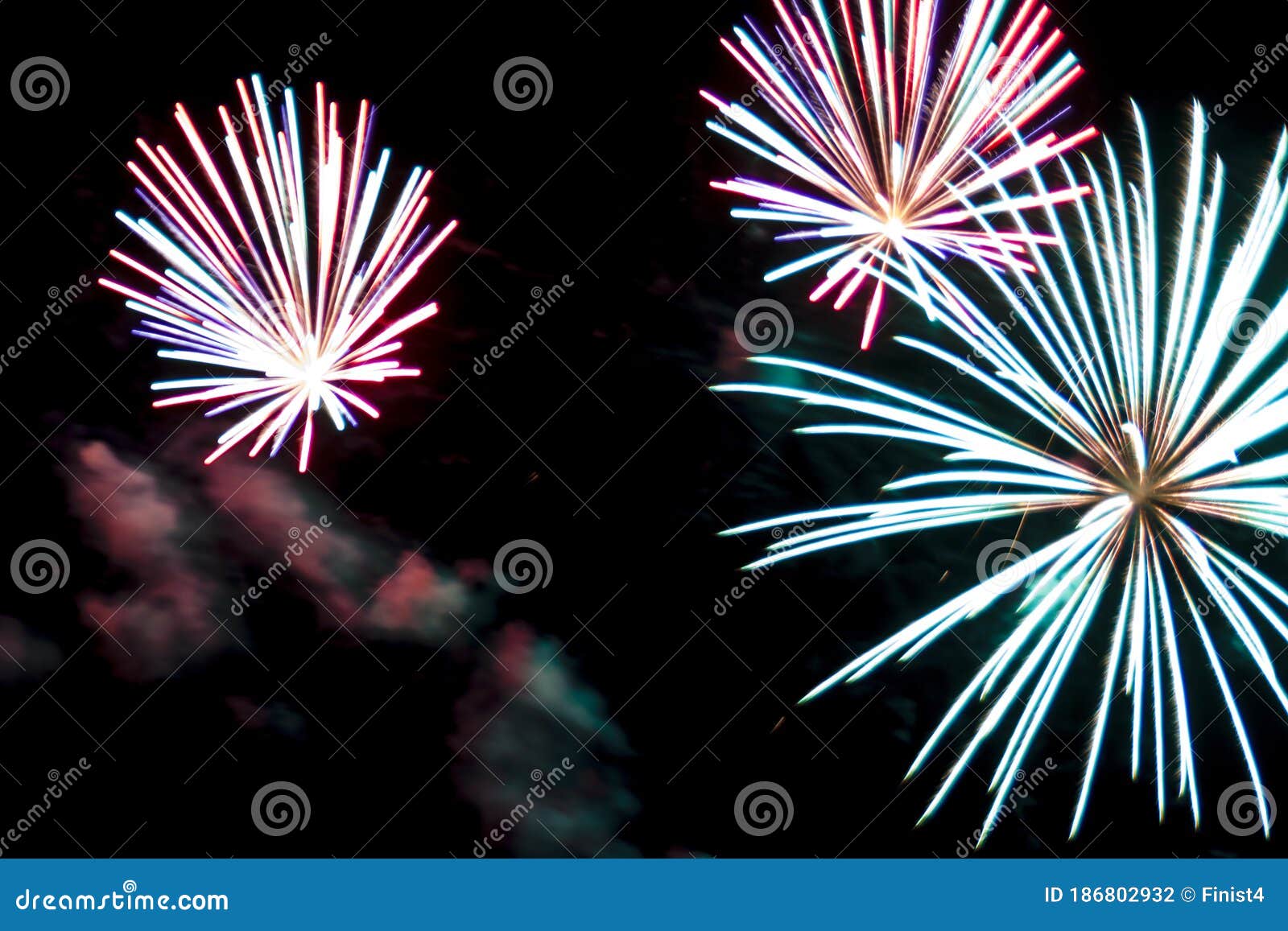 Colorful Fireworks In The Night Sky In The Form Of Flowers Stock Photo