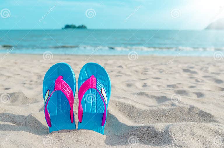 Colorful Flip Flops on Beach Against Sunny Sky. Stock Image - Image of ...