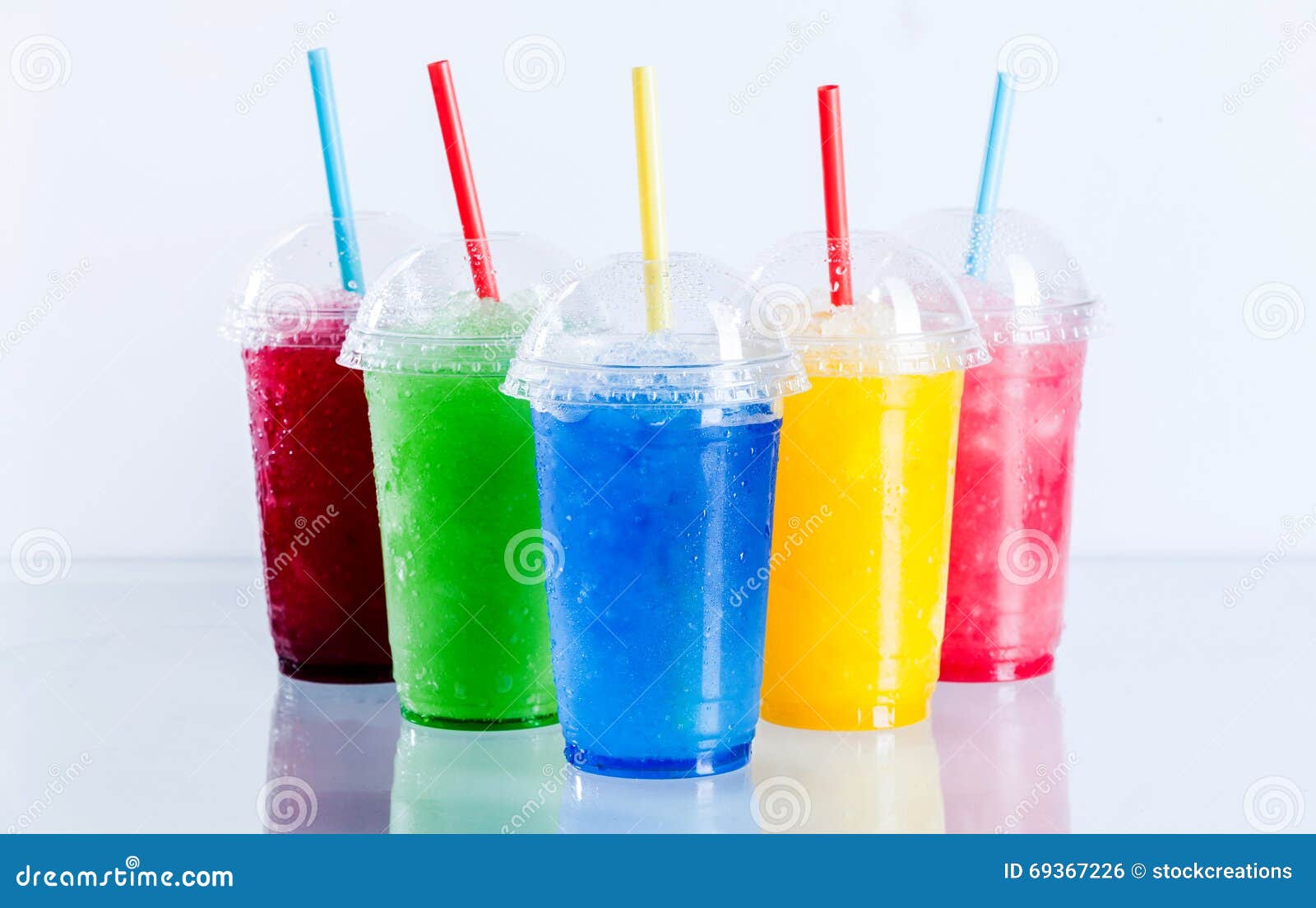 Colorful Frozen Fruit Slush Drinks In Plastic Cups Stock Photography colorful-frozen-fruit-slush-drinks-in-plastic-cups-stock-photography