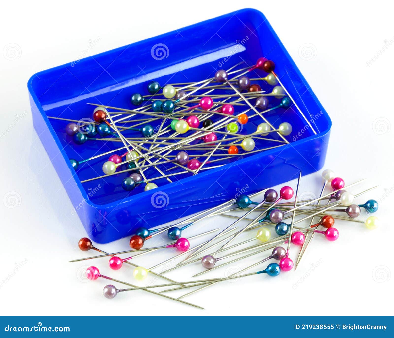 closeup-colourful-little-glass-tipped-sewing-pins-scattered-white
