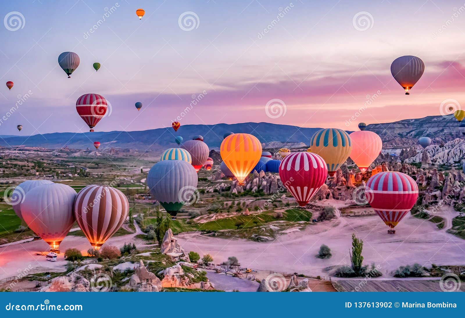 colorful hot air balloons before launch in goreme national park, cappadocia, turkey