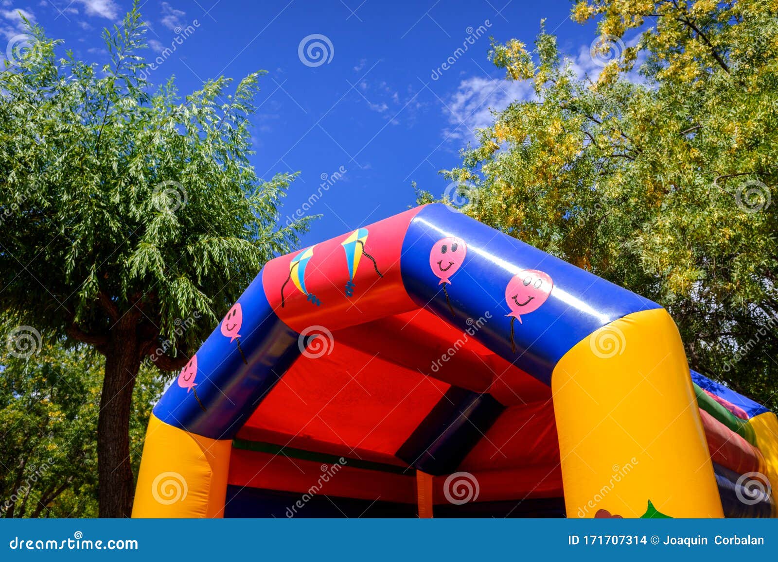 Colorful inflatable castles for children to jump and bounce in an amusement park.