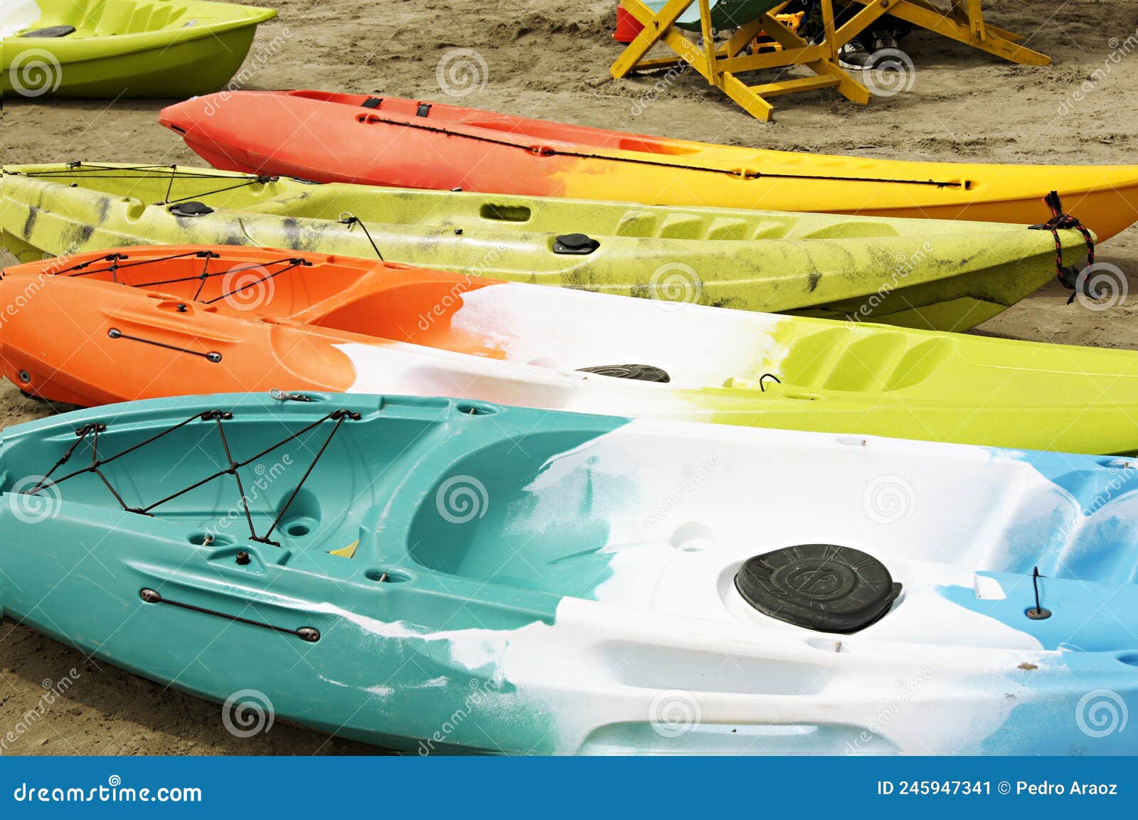 colorful 4 kayaks on beach