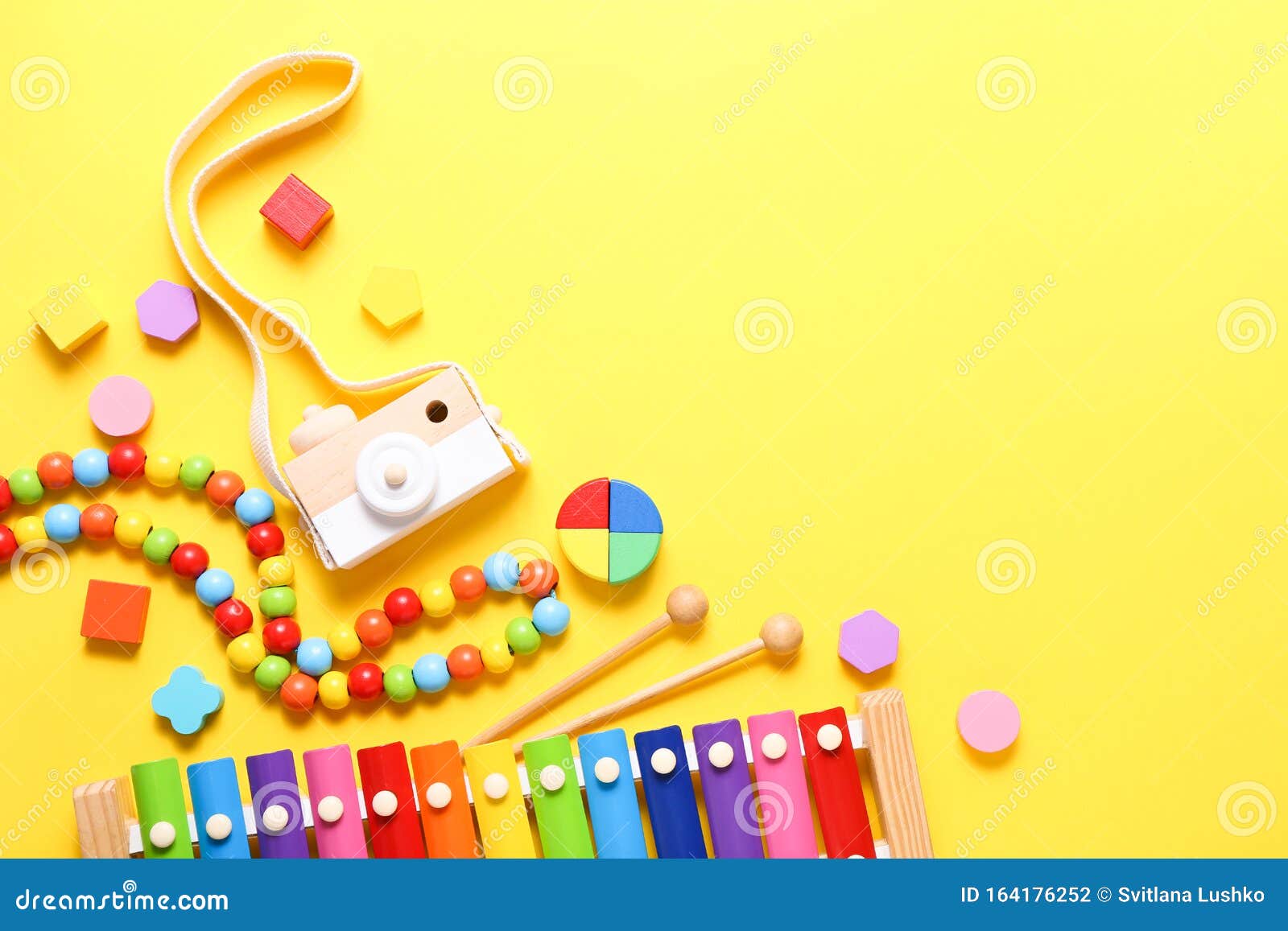 Colorful Kids Toys on Yellow Background. Top View, Flat Lay Stock Photo -  Image of music, camera: 164176252