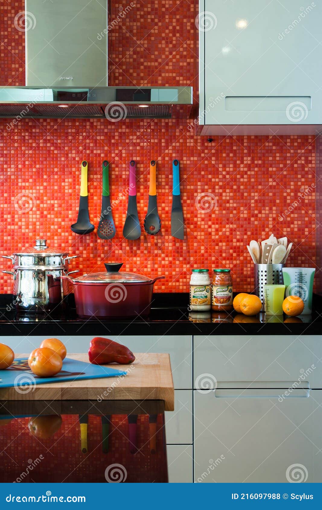 colorful kitchen with interesting red-tiled wall