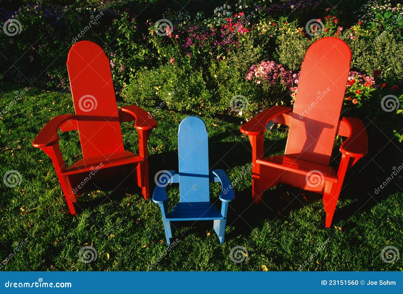 Colorful Lawn Chairs in Garden Stock Photo - Image of threesome, blue ...