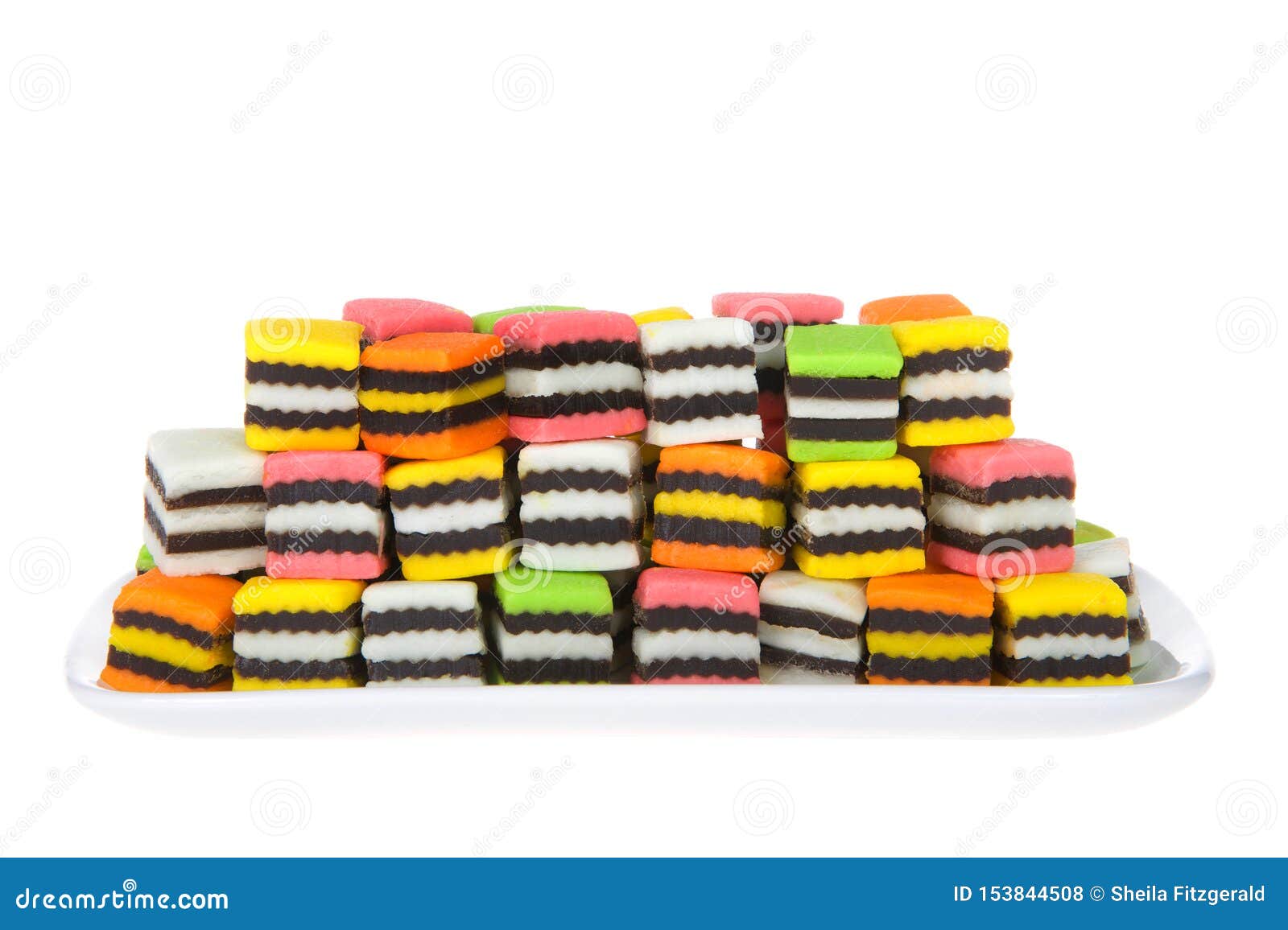 Colorful Licorice Candy Squares on Rectangular Plate Isolated Stock