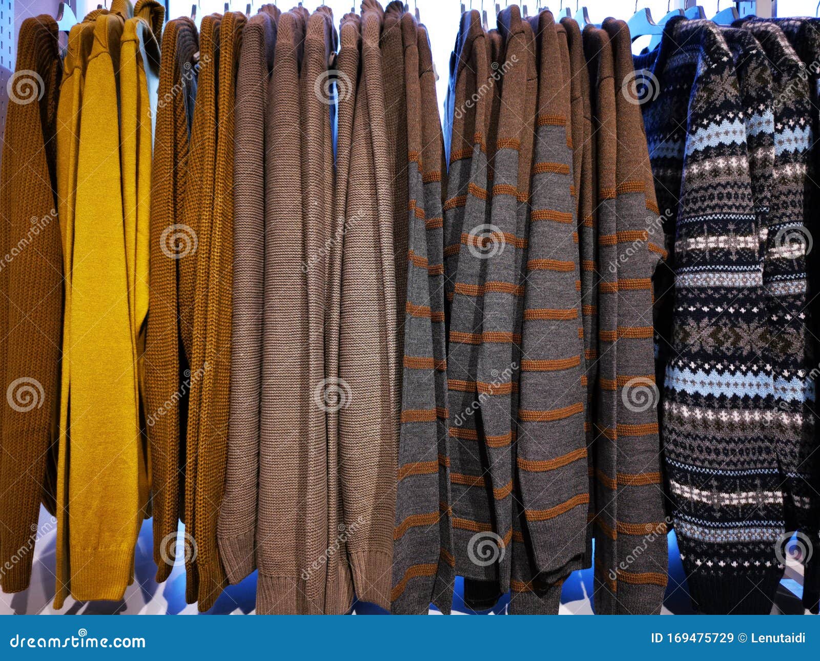 Colorful Men Sweaters Hanging in Wardrobe Stock Image - Image of ...