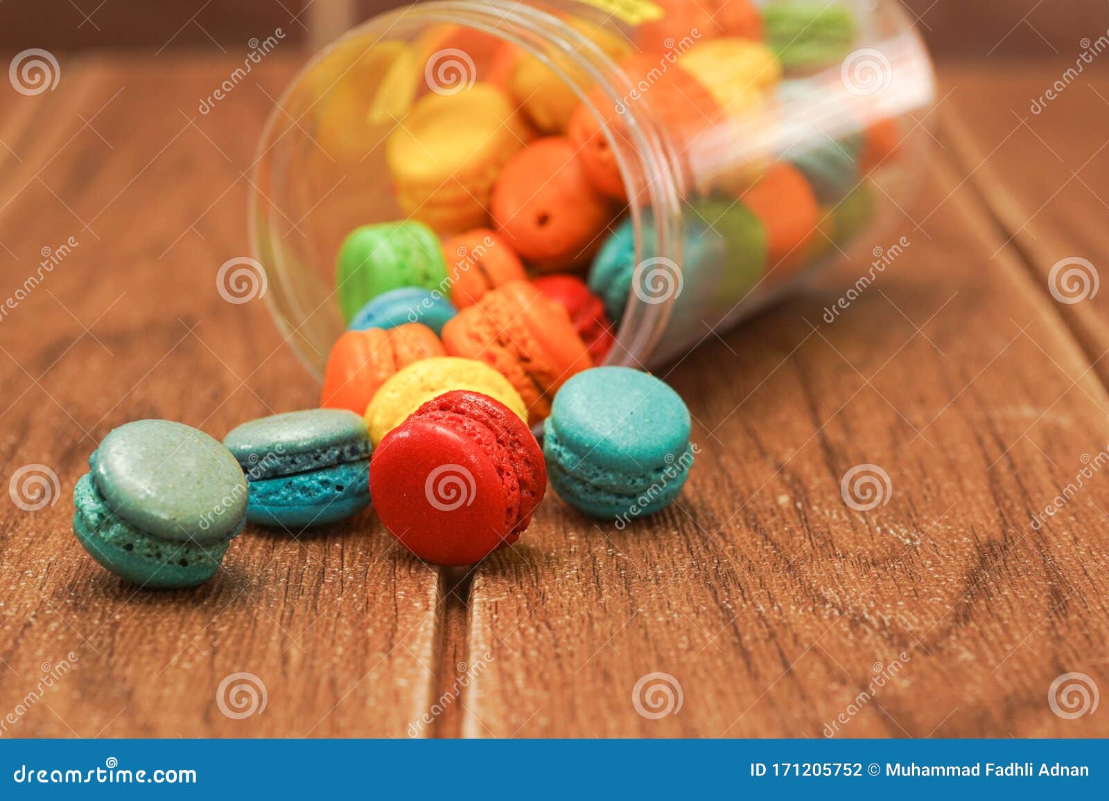 Colorful Mini Macaroons Against Wooden Background Stock Photo - Image ...