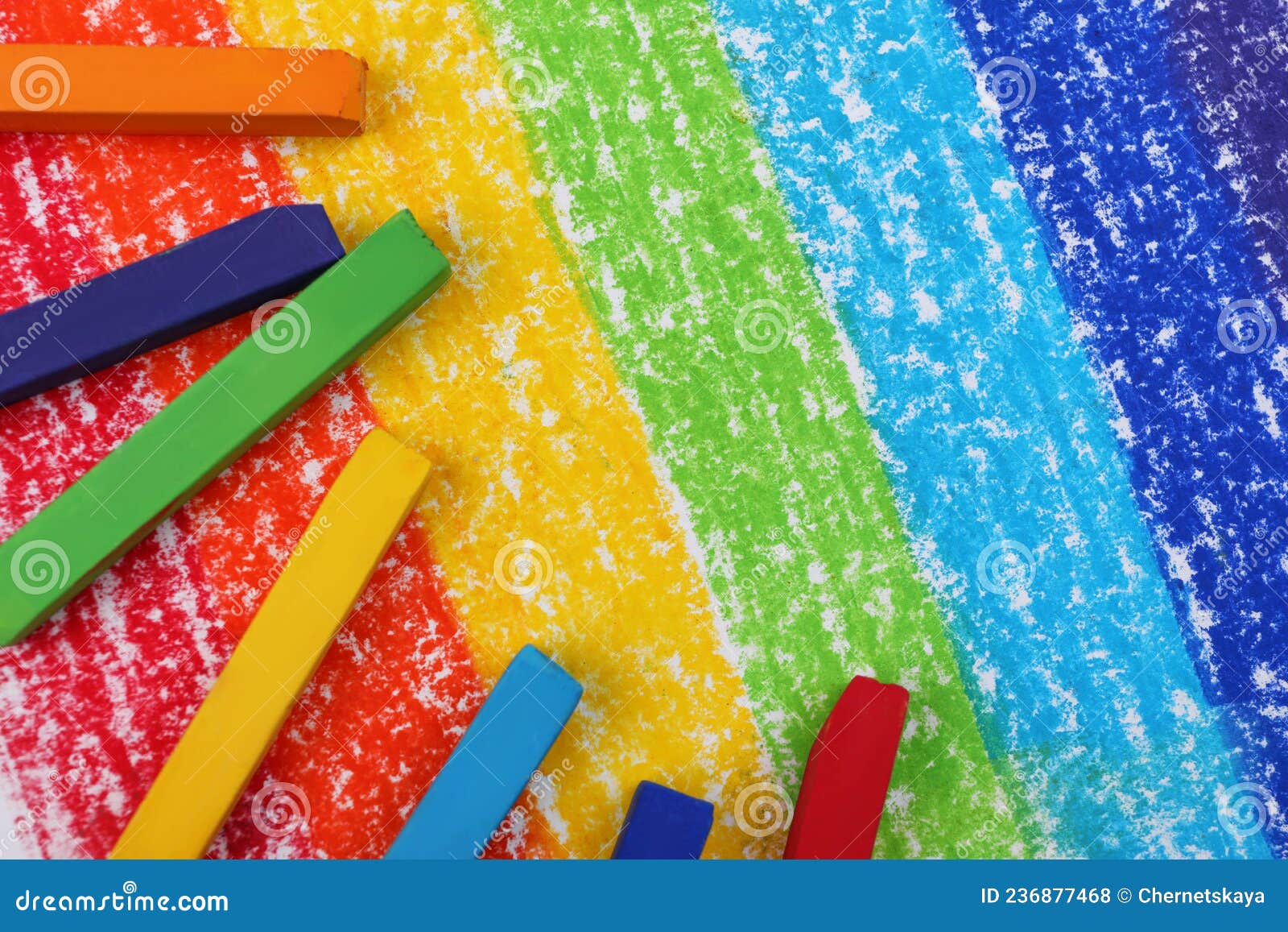 Colorful Pastel Chalks on Drawing of Rainbow, Flat Lay. Space for Text