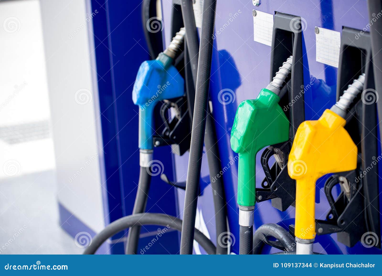 colorful petrol pump filling nozzles on white background