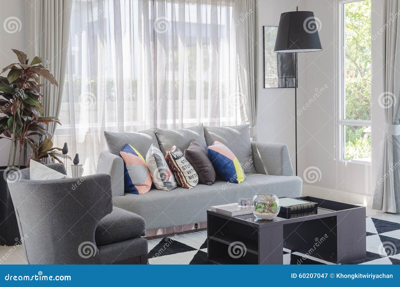 Colorful Pillows On Modern Grey Sofa In Living Room Stock Photo