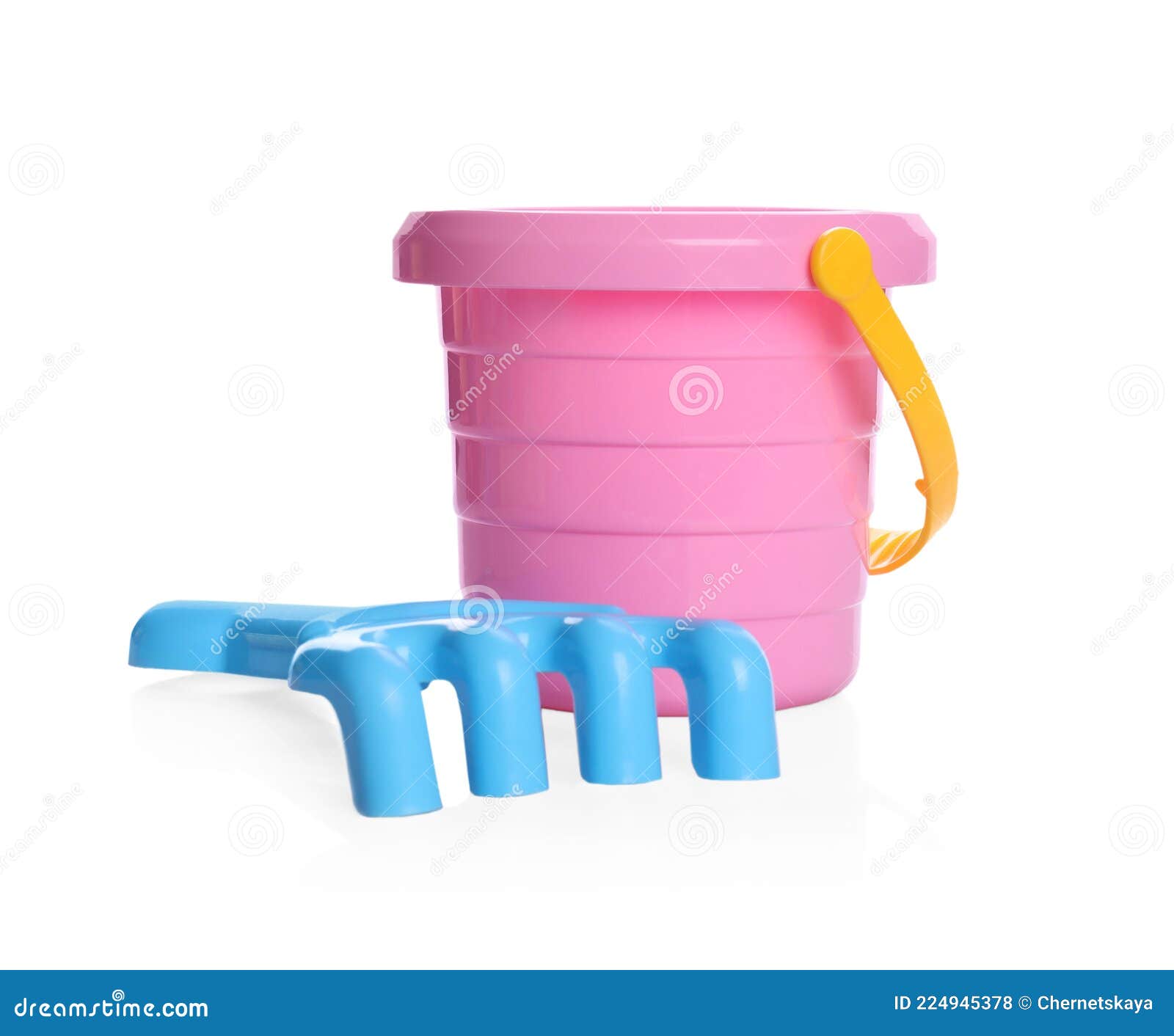 Colorful Plastic Toy Bucket and Rake Isolated on White Stock Photo