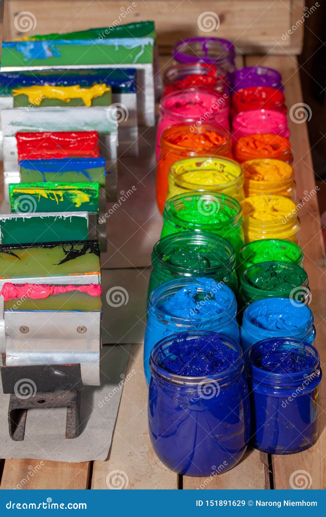 colorful plastisol ink in transparent bottles in screen printing