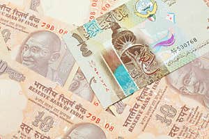 A Dinar Bank Note From Kuwait With Indian Ten Rupee Bank Notes Stock 