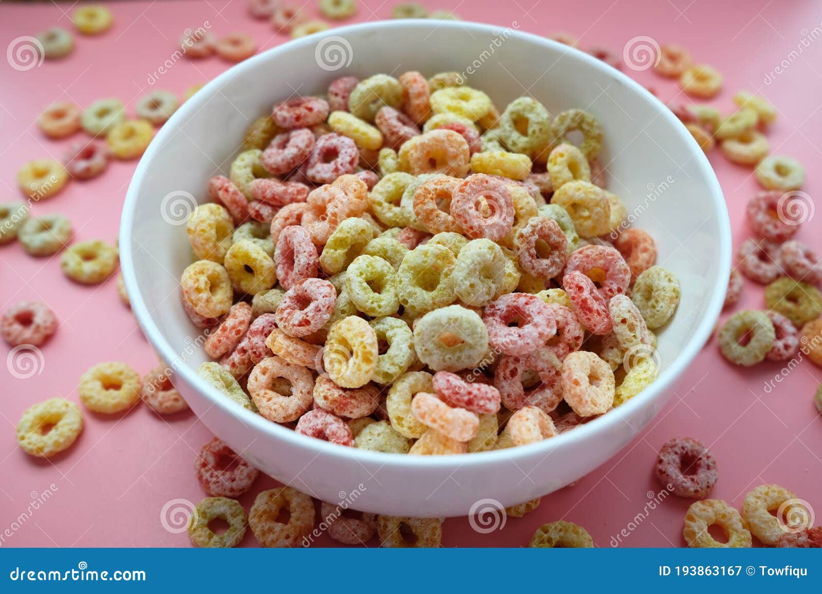Colorful Ring Corn Flakes in a Bowl on Pink Background Stock Image