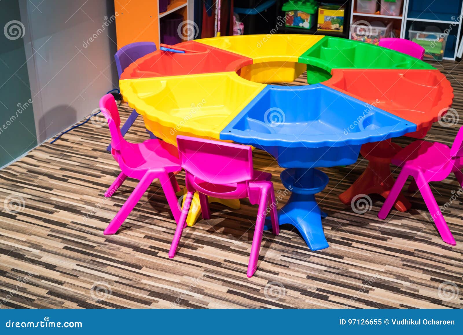 Colorful Round Plastic Table With Sand Pit And Chair On Pattern